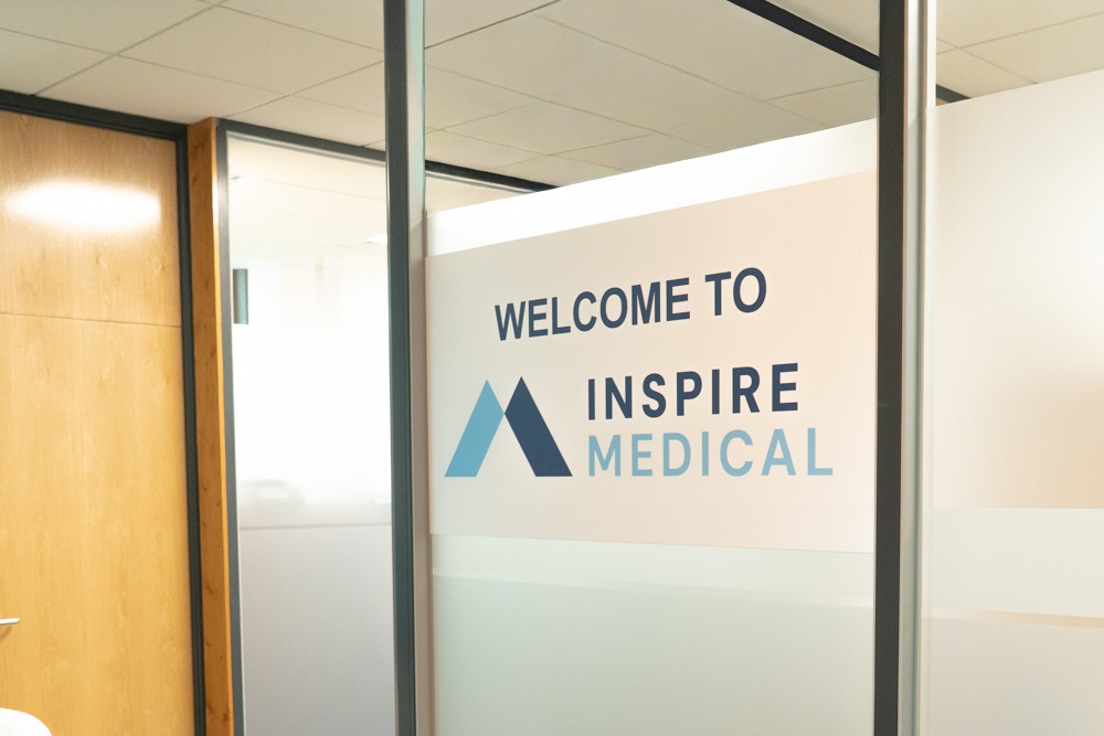 The Welcome to Inspire Medical glass panel inside the office